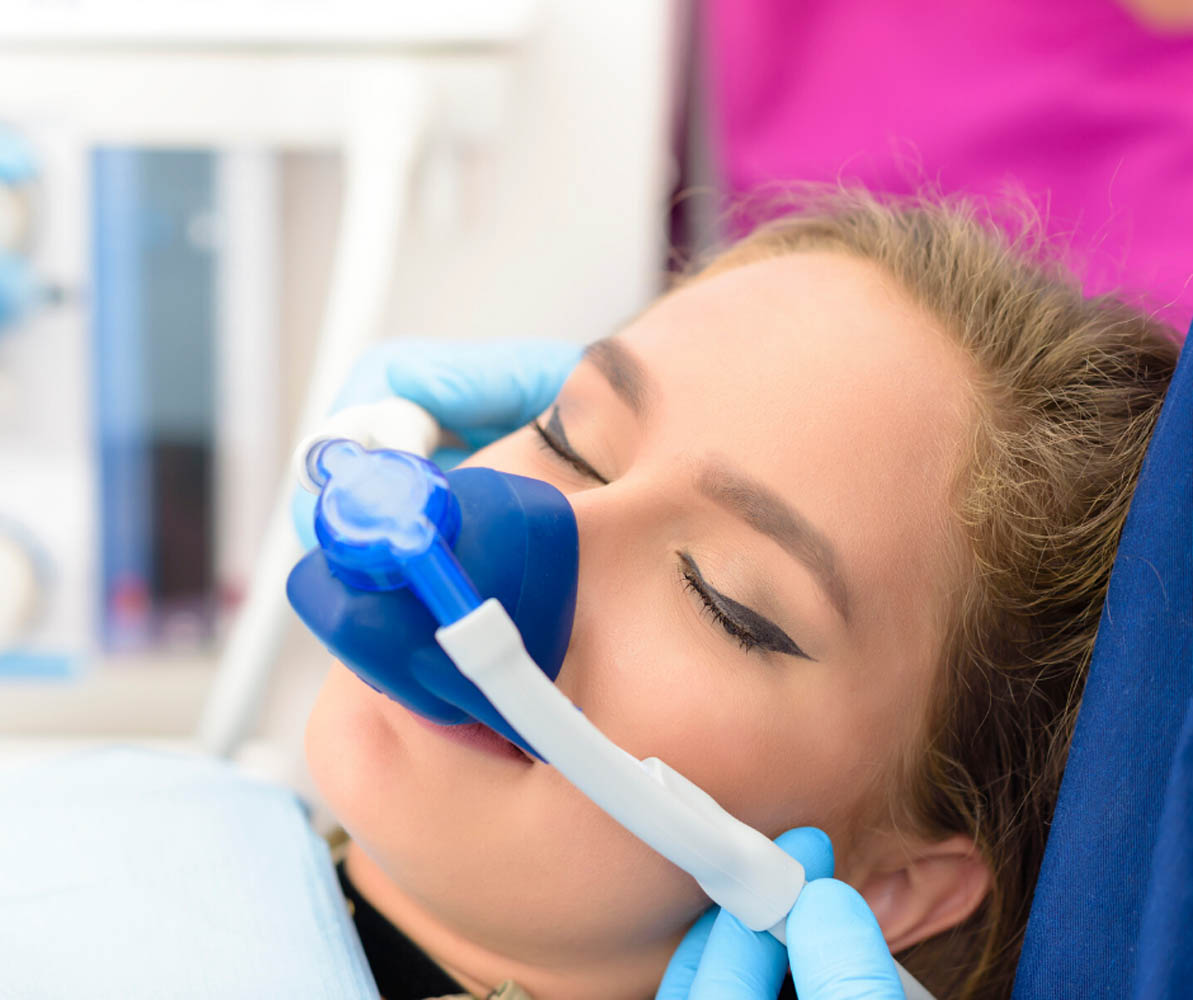 woman receiving sedation before dental procedure